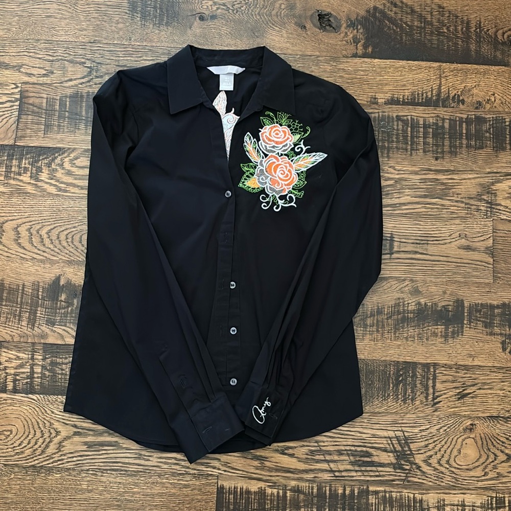 Long sleeve button down shirt. Super cute floral pattern, and never worn.
